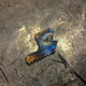 A small chip that fell from a bearing that had to be cut from it’s shaft.
